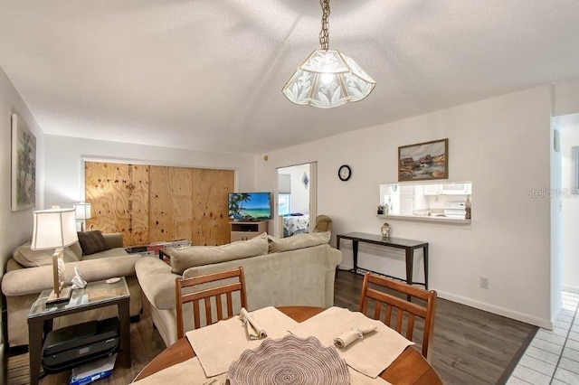 1036 W Peppertree Ln Unit 113B, Sarasota, FL 34242 - living room with baseboards