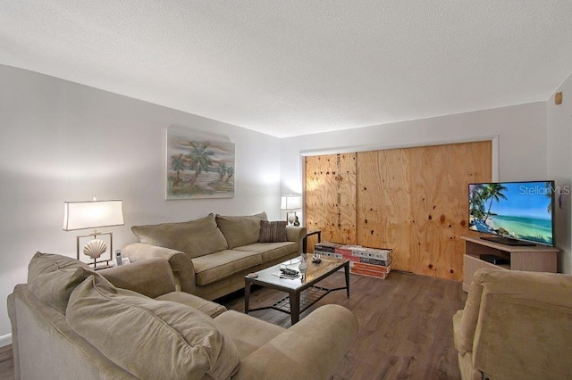 1036 W Peppertree Ln Unit 113B, Sarasota, FL 34242 - living area with wood finished floors and a textured ceiling