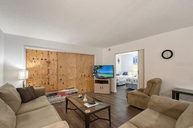 1036 W Peppertree Ln Unit 113B, Sarasota, FL 34242 - living room with wood finished floors and a textured ceiling