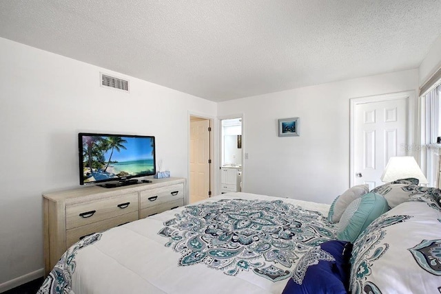 1036 W Peppertree Ln Unit 113B, Sarasota, FL 34242 - bedroom featuring a textured ceiling