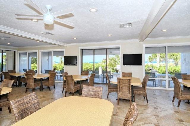 1036 W Peppertree Ln Unit 113B, Sarasota, FL 34242 - dining area featuring crown molding, a textured ceiling, a ceiling fan, and recessed lighting
