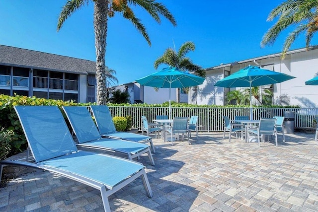 1036 W Peppertree Ln Unit 113B, Sarasota, FL 34242 - view of patio / terrace featuring outdoor dining space