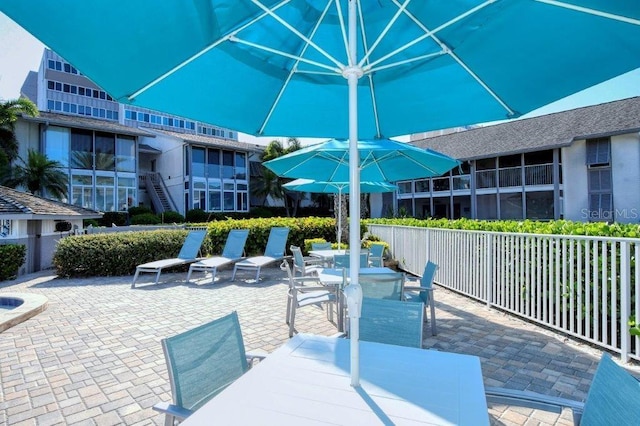 1036 W Peppertree Ln Unit 113B, Sarasota, FL 34242 - view of patio / terrace featuring outdoor dining area