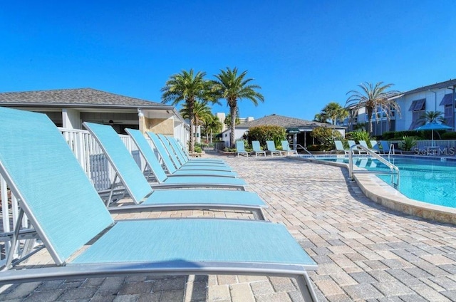 1036 W Peppertree Ln Unit 113B, Sarasota, FL 34242 - community pool featuring a patio and a residential view