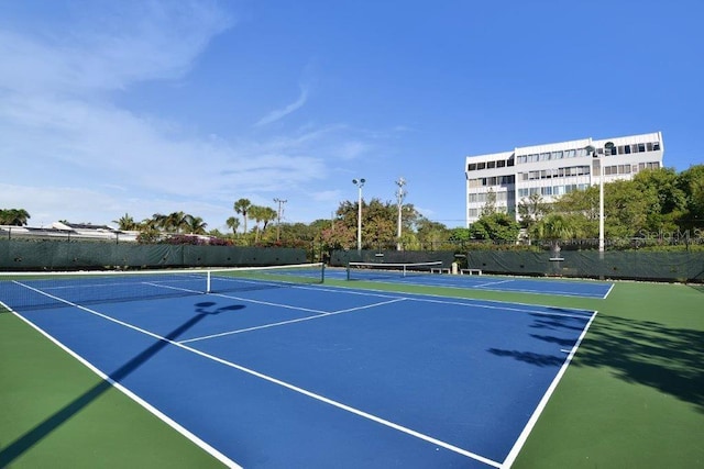 1036 W Peppertree Ln Unit 113B, Sarasota, FL 34242 - view of tennis court with community basketball court