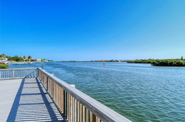 1036 W Peppertree Ln Unit 113B, Sarasota, FL 34242 - dock area featuring a water view