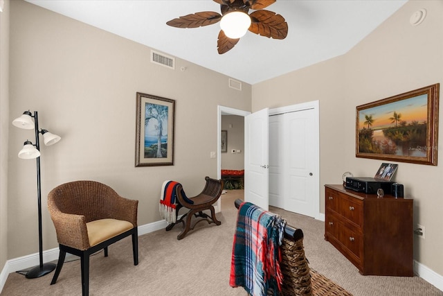 14041 Bellagio Way Unit 414, Osprey, FL 34229 - living area featuring a ceiling fan and light carpet