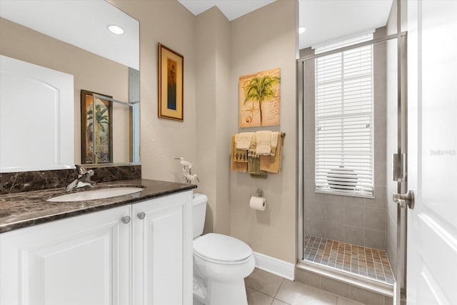 14041 Bellagio Way Unit 414, Osprey, FL 34229 - full bathroom featuring a shower stall, plenty of natural light, vanity, and tile patterned flooring