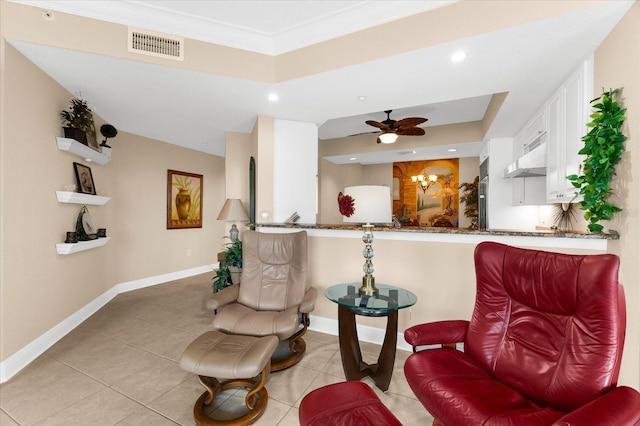 14041 Bellagio Way Unit 414, Osprey, FL 34229 - living area with light tile patterned flooring, a ceiling fan, recessed lighting, crown molding, and a tray ceiling