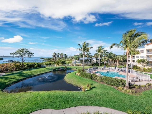 14041 Bellagio Way Unit 414, Osprey, FL 34229 - view of home's community featuring a water view, a yard, and a pool