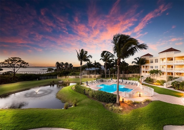 14041 Bellagio Way Unit 414, Osprey, FL 34229 - community pool with a water view and a lawn