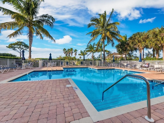 14041 Bellagio Way Unit 414, Osprey, FL 34229 - community pool featuring a patio area