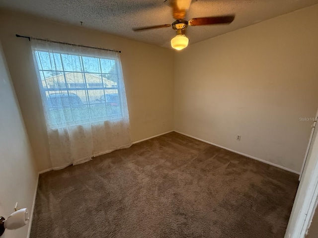 1264 Village Way, Orlando, FL 32807 - empty room with dark colored carpet, a ceiling fan, and a textured ceiling