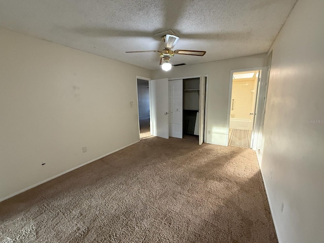1264 Village Way, Orlando, FL 32807 - unfurnished bedroom with carpet flooring, a textured ceiling, a closet, ceiling fan, and connected bathroom