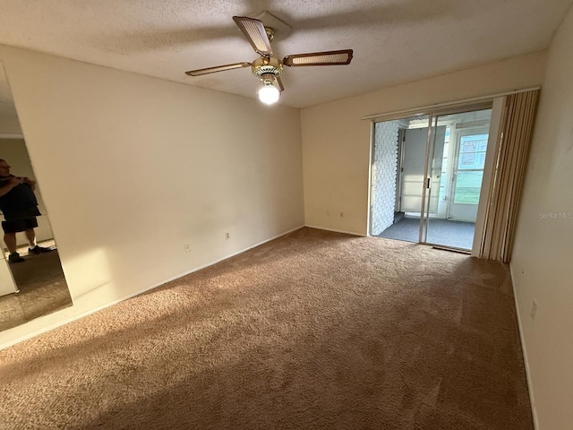 1264 Village Way, Orlando, FL 32807 - unfurnished bedroom with carpet floors, access to outside, a textured ceiling, and a ceiling fan