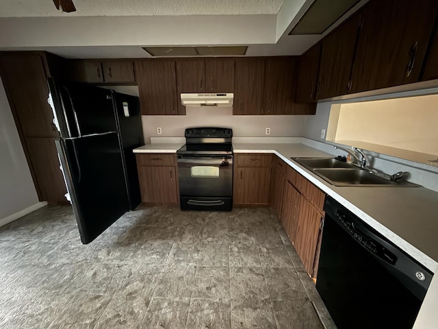 1264 Village Way, Orlando, FL 32807 - kitchen with black appliances, under cabinet range hood, and light countertops