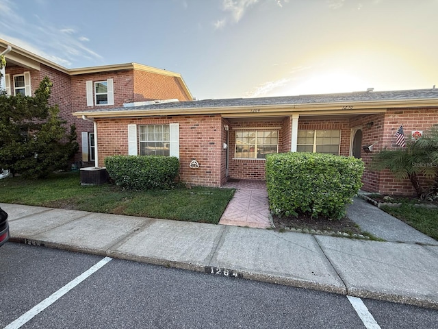 1264 Village Way, Orlando, FL 32807 - view of front of home with brick siding and uncovered parking