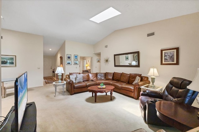 4001 Wilshire Cir E Unit 72, Sarasota, FL 34238 - carpeted living area featuring lofted ceiling and a skylight