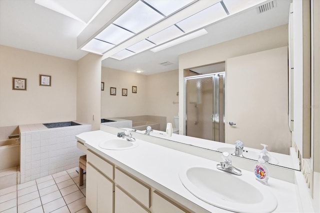 4001 Wilshire Cir E Unit 72, Sarasota, FL 34238 - full bath with a stall shower, double vanity, a bath, and tile patterned floors