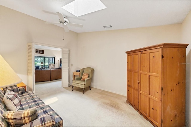 4001 Wilshire Cir E Unit 72, Sarasota, FL 34238 - living area with a skylight, light colored carpet, and a ceiling fan