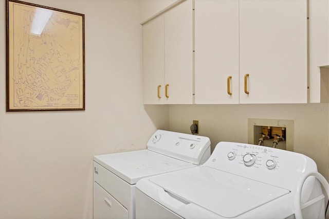 4001 Wilshire Cir E Unit 72, Sarasota, FL 34238 - washroom featuring cabinet space and washing machine and dryer