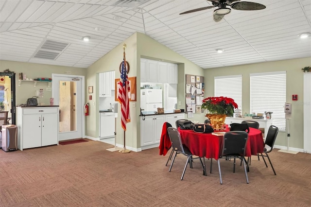 4001 Wilshire Cir E Unit 72, Sarasota, FL 34238 - dining area featuring ceiling fan, vaulted ceiling, and light carpet