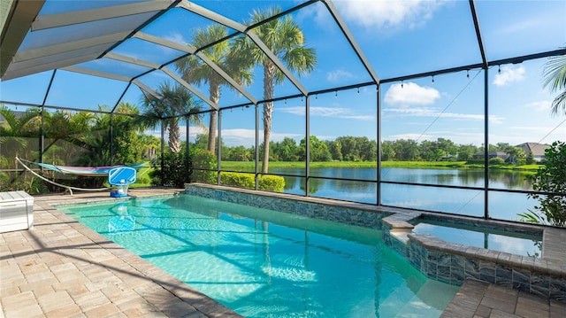 3431 Chestertown Loop, Bradenton, FL 34211 - view of swimming pool featuring a lanai, a patio, a water view, and a pool with connected hot tub
