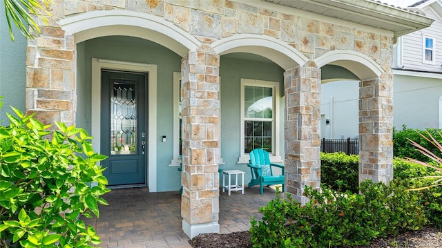3431 Chestertown Loop, Bradenton, FL 34211 - doorway to property with stone siding and stucco siding