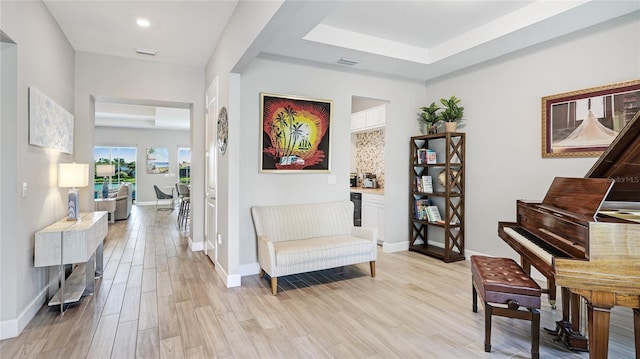 3431 Chestertown Loop, Bradenton, FL 34211 - living area with light wood finished floors, a raised ceiling, and recessed lighting