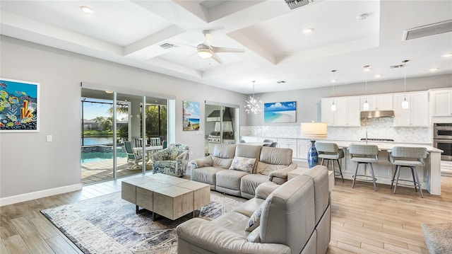 3431 Chestertown Loop, Bradenton, FL 34211 - living room with ceiling fan, light wood-style floors, coffered ceiling, beamed ceiling, and recessed lighting
