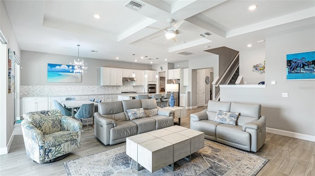 3431 Chestertown Loop, Bradenton, FL 34211 - living area with light wood-style floors, coffered ceiling, stairs, ceiling fan, and beamed ceiling