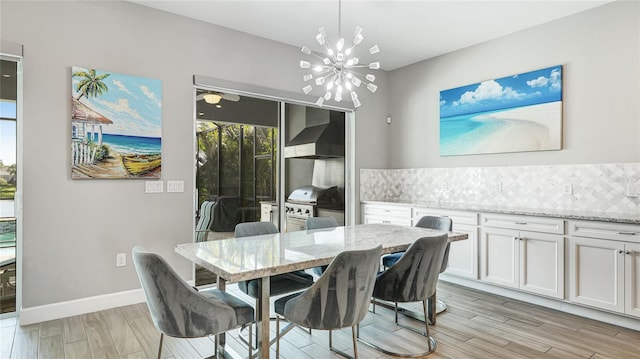 3431 Chestertown Loop, Bradenton, FL 34211 - dining space with a chandelier and light wood-type flooring