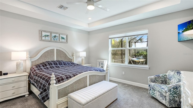 3431 Chestertown Loop, Bradenton, FL 34211 - bedroom with carpet floors, a raised ceiling, and a ceiling fan