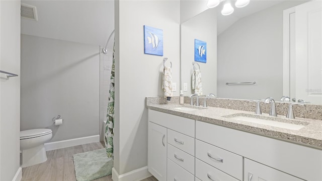 3431 Chestertown Loop, Bradenton, FL 34211 - bathroom featuring double vanity, a shower with shower curtain, and wood finished floors