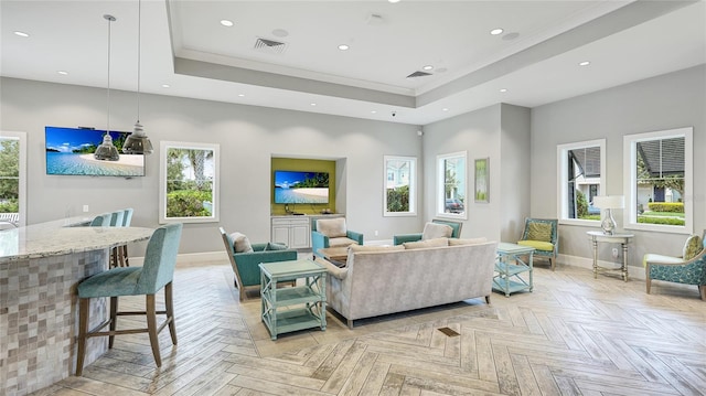 3431 Chestertown Loop, Bradenton, FL 34211 - living room featuring a tray ceiling, recessed lighting, and crown molding