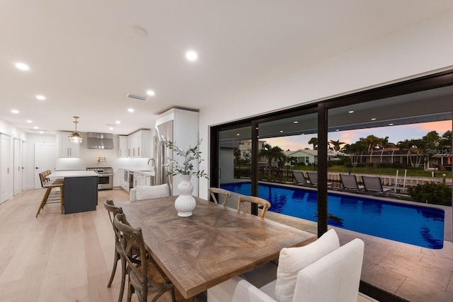 510 Putter Ln, Longboat Key, FL 34228 - dining space with recessed lighting and light wood-style flooring