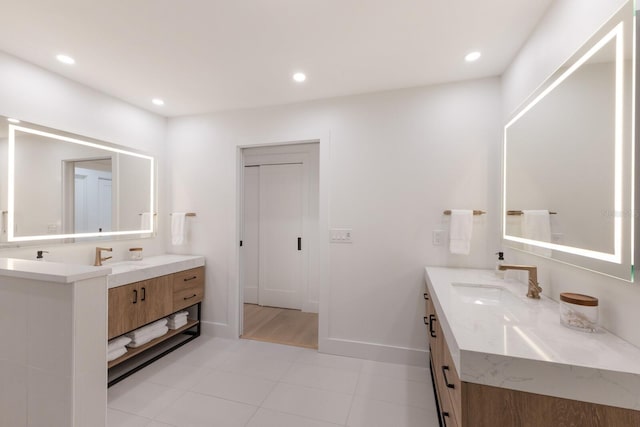 510 Putter Ln, Longboat Key, FL 34228 - full bathroom with two vanities, recessed lighting, and tile patterned flooring