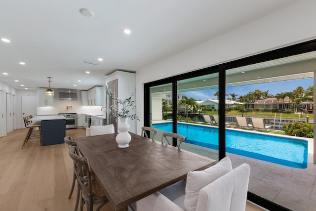 510 Putter Ln, Longboat Key, FL 34228 - dining space with recessed lighting and light wood-style floors