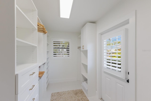 510 Putter Ln, Longboat Key, FL 34228 - walk in closet featuring light tile patterned floors