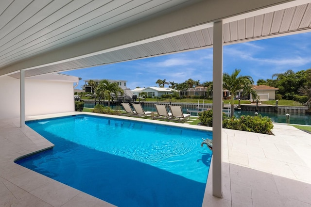 510 Putter Ln, Longboat Key, FL 34228 - swimming pool with a water view and a patio