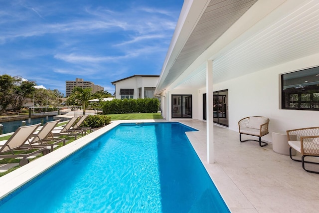 510 Putter Ln, Longboat Key, FL 34228 - swimming pool with french doors and a patio