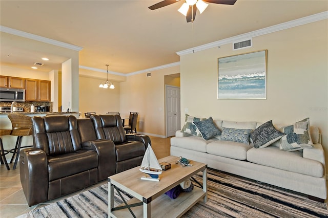7121 River Hammock Dr Unit 102, Bradenton, FL 34212 - living area featuring a ceiling fan, ornamental molding, a chandelier, and recessed lighting