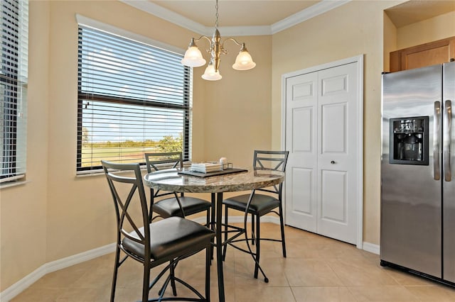 7121 River Hammock Dr Unit 102, Bradenton, FL 34212 - dining room with a chandelier, ornamental molding, and light tile patterned floors