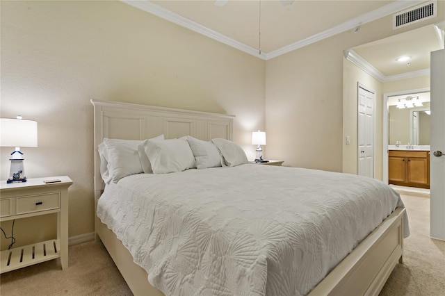 7121 River Hammock Dr Unit 102, Bradenton, FL 34212 - bedroom with light colored carpet, crown molding, and connected bathroom