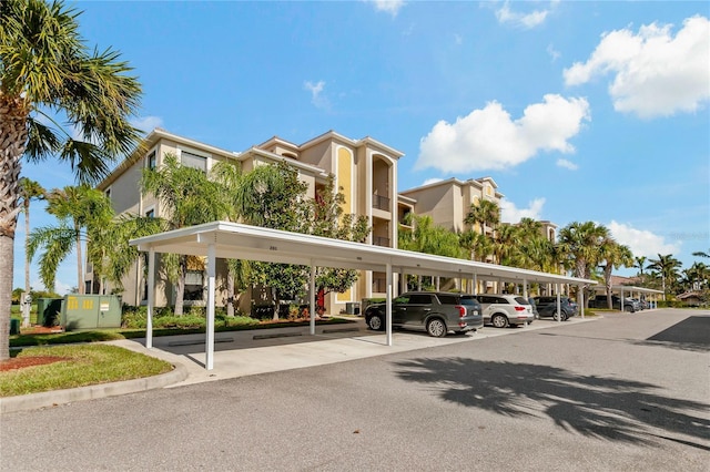 7121 River Hammock Dr Unit 102, Bradenton, FL 34212 - view of property featuring covered parking