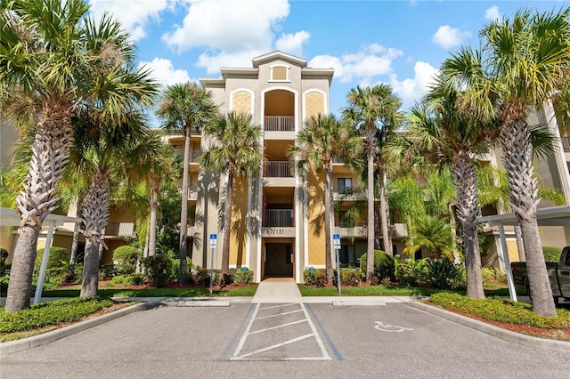 7121 River Hammock Dr Unit 102, Bradenton, FL 34212 - view of building exterior with uncovered parking