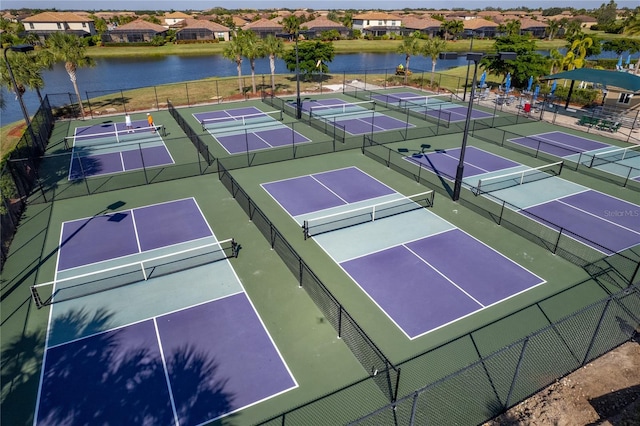 7121 River Hammock Dr Unit 102, Bradenton, FL 34212 - view of tennis court featuring community basketball court, a water view, and a residential view