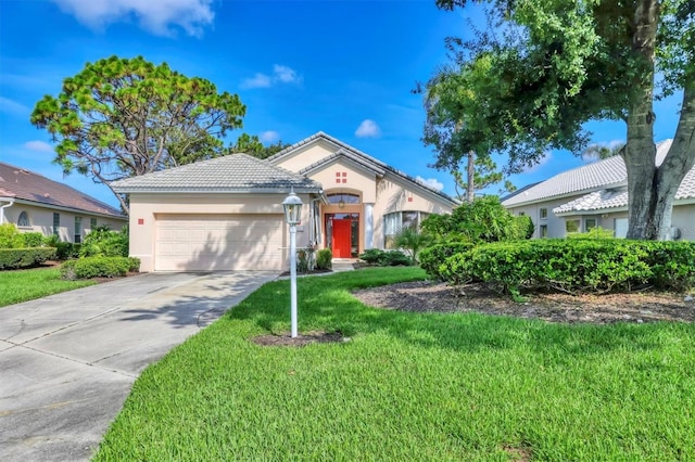 7960 Hampton Ct, University Park, FL 34201 - view of front of house featuring a garage, stucco siding, a front yard, driveway, and a tile roof