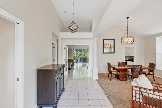 7960 Hampton Ct, University Park, FL 34201 - foyer entrance featuring vaulted ceiling, light tile patterned floors, light carpet, and ornate columns