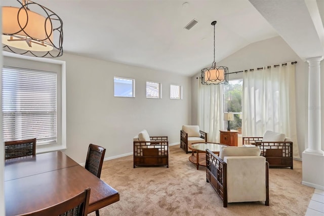 7960 Hampton Ct, University Park, FL 34201 - dining room featuring decorative columns, plenty of natural light, light colored carpet, and vaulted ceiling